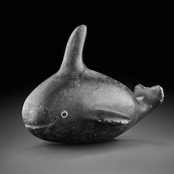 cute rounded whale in black stone