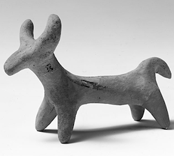 an abstract bull-like figure with rounded horns and short legs